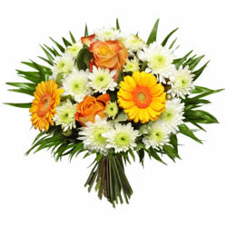 Bouquet rond coloré confectionné avec des fleurs de saisons courtes tiges accompagné d'une verdure légère livraison a Monthey