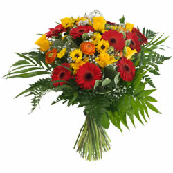 Bouquet rond de gerberas et fleurs de saison relevé de verdure livraison a Pully